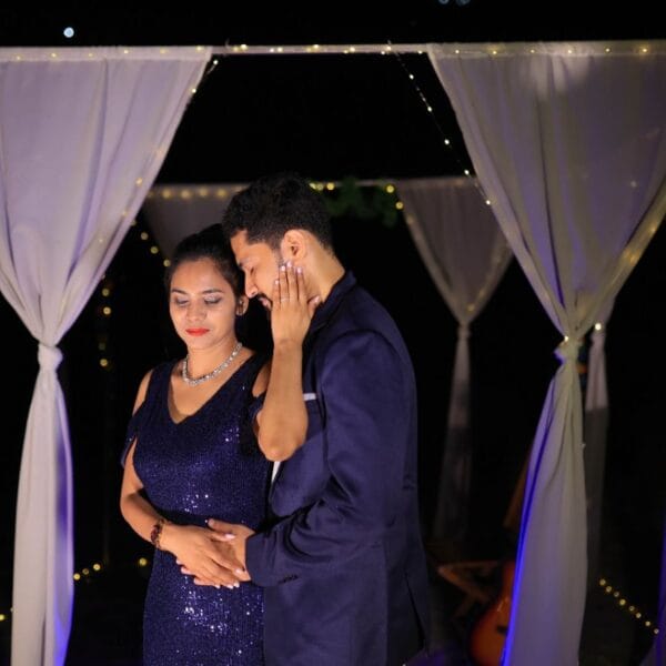 A couple sharing a quiet moment in a romantic setup.