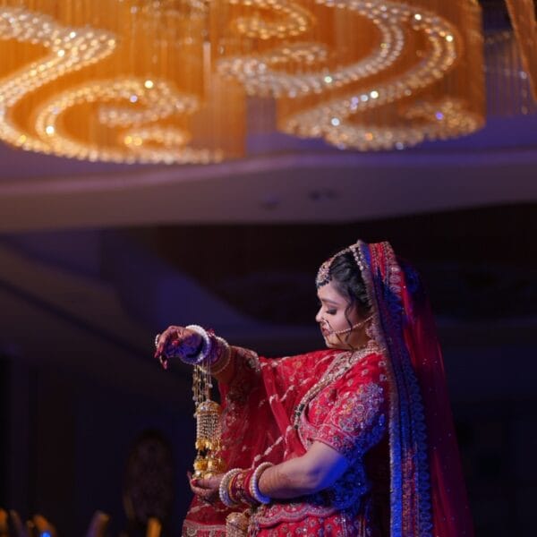 A traditionally dressed bride posing with her kalire.
