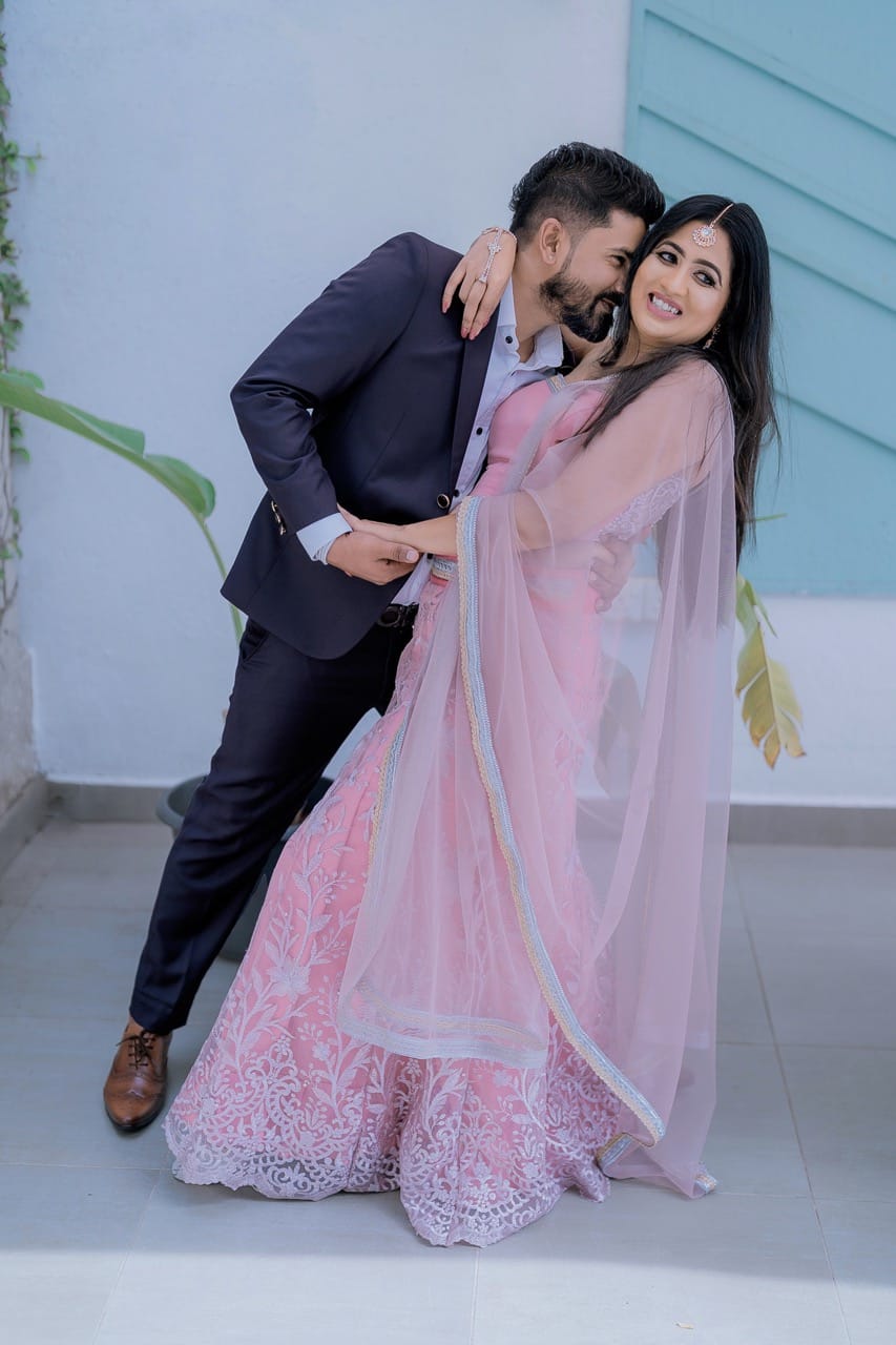 Couple enjoying a joyful photoshoot moment.