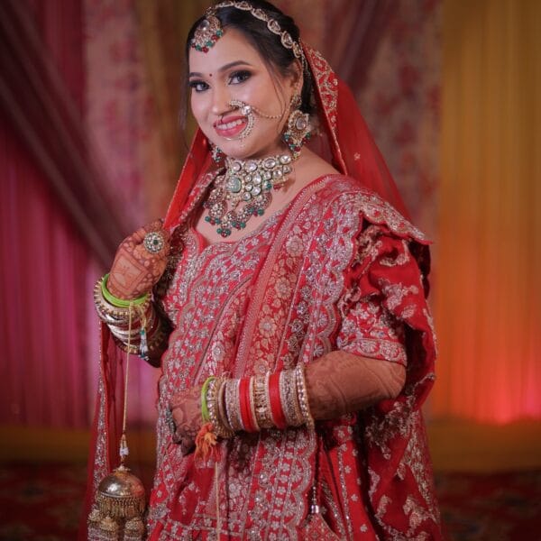 Bridal photoshoot featuring a bride in traditional red attire.