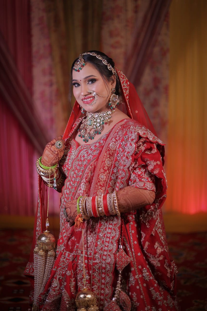 Bridal photoshoot featuring a bride in traditional red attire.